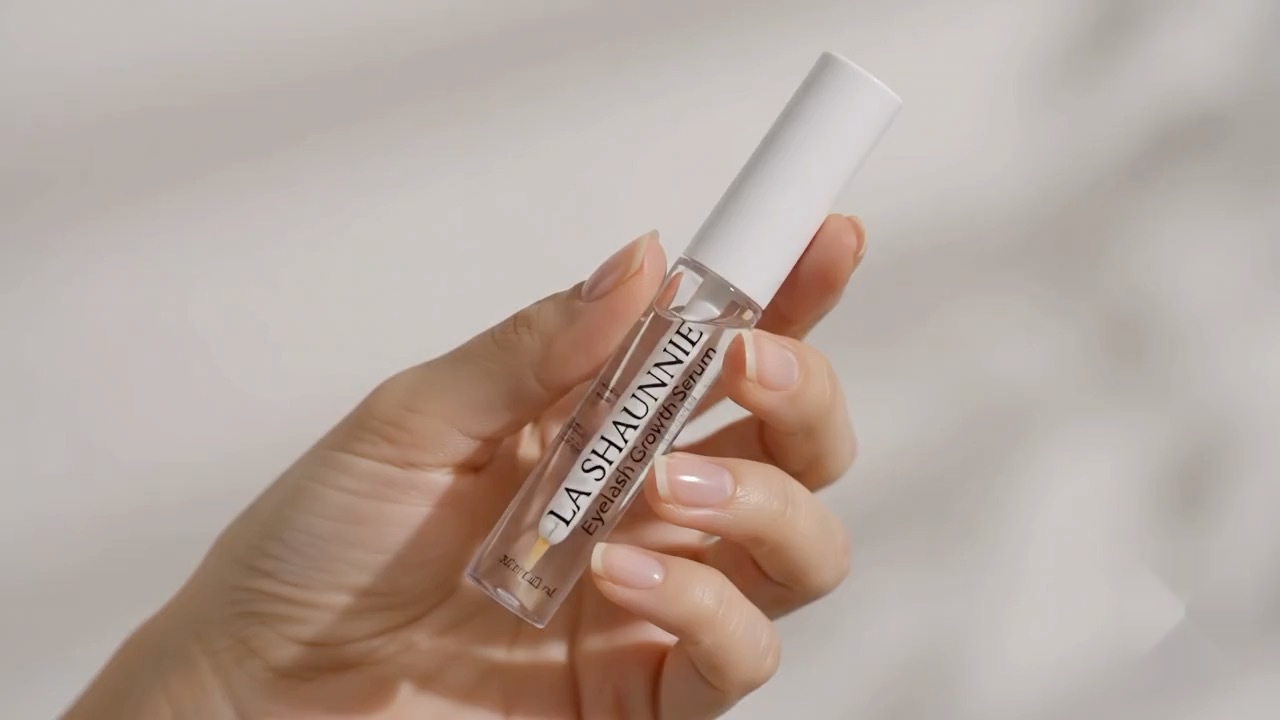 LA SHAUNNIE eyelash growth serum held in hand